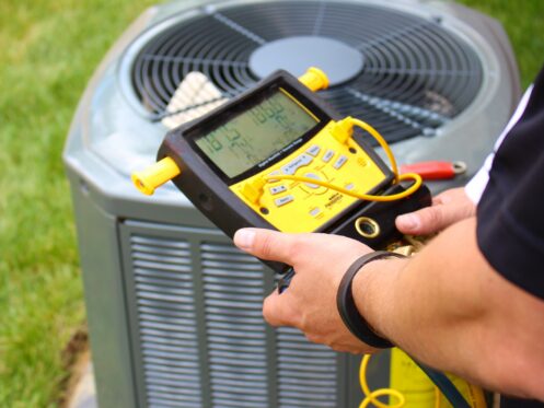 An AC tech checking the status of an AC in Bellingham