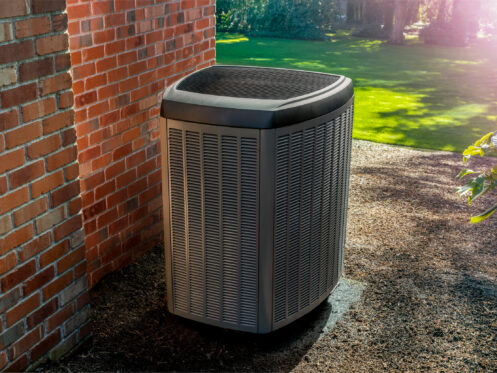 An AC unit in the backyard of a Bellingham, WA home