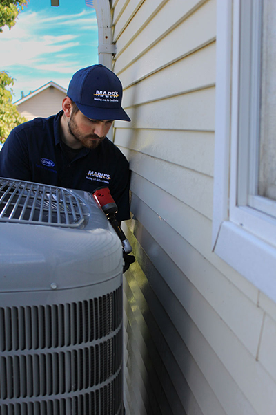 Tech work on AC unit