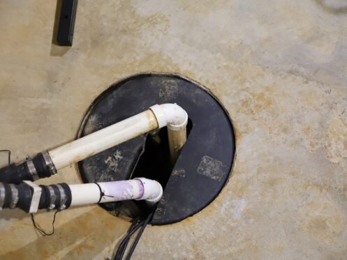 A sump pump in a home basement
